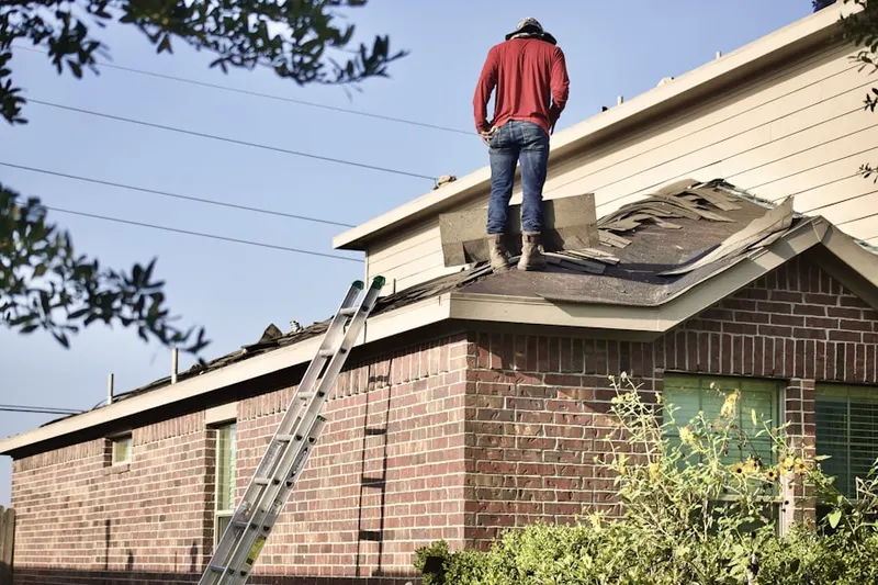Professional roofer working on a residential roof in Moorestown